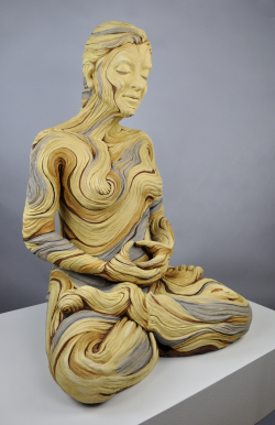 Life sized meditating figure with bristlecone pine inspired textures. White stoneware and underglazes.