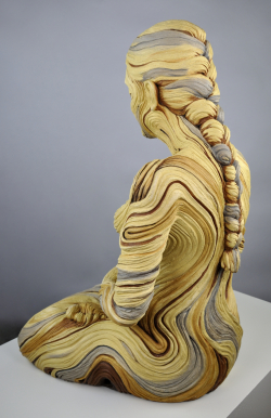 Life sized meditating figure with bristlecone pine inspired textures. White stoneware and underglazes.