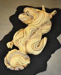 Large than life sized sleeping figure with bristlecone pine inspired textures. White stoneware and underglazes.