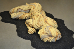 Large than life sized sleeping figure with bristlecone pine inspired textures. White stoneware and underglazes.